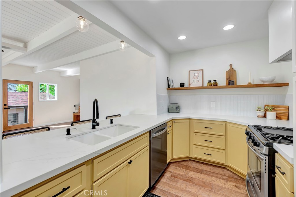 68 Laurel Drive Altadena, CA 91001 - Photo 14 of 59 a kitchen with a sink and cabinets