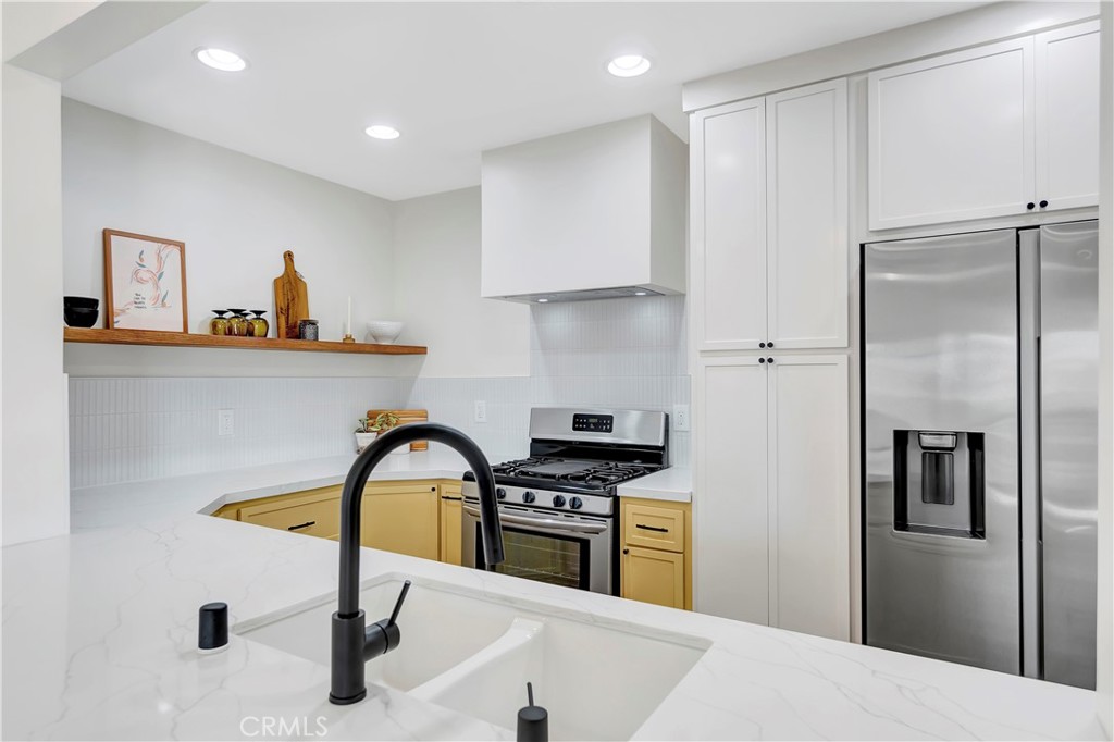 68 Laurel Drive Altadena, CA 91001 - Photo 15 of 59 a kitchen with a refrigerator and a sink