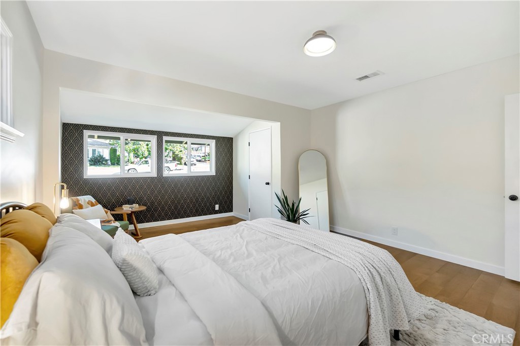 68 Laurel Drive Altadena, CA 91001 - Photo 30 of 59 a bedroom with a bed and wooden floor