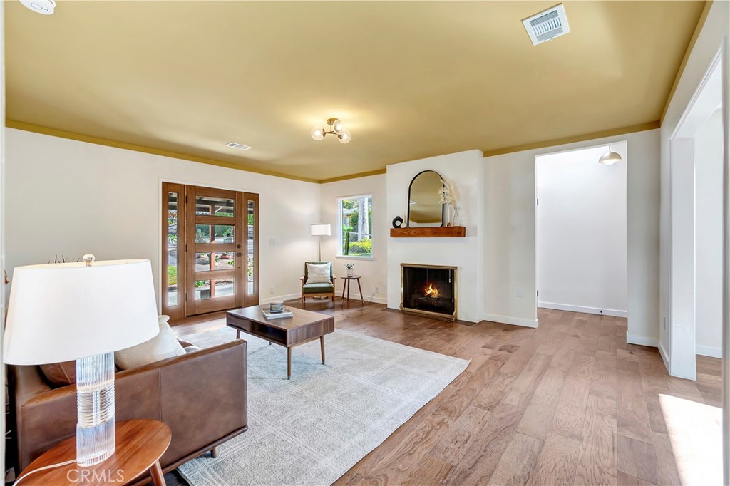 68 Laurel Drive Altadena, CA 91001 - Photo 8 of 59 a living room with furniture and a fireplace