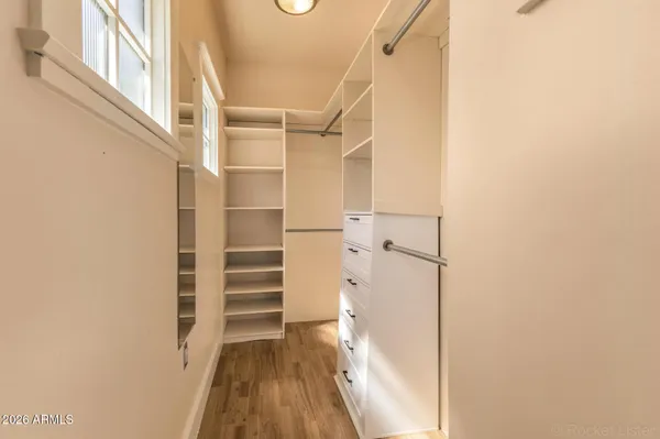 a view of closet area with empty racks