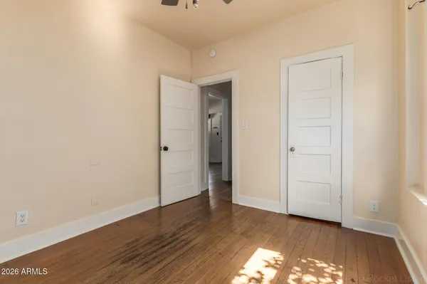 a view of hallway with wooden floor