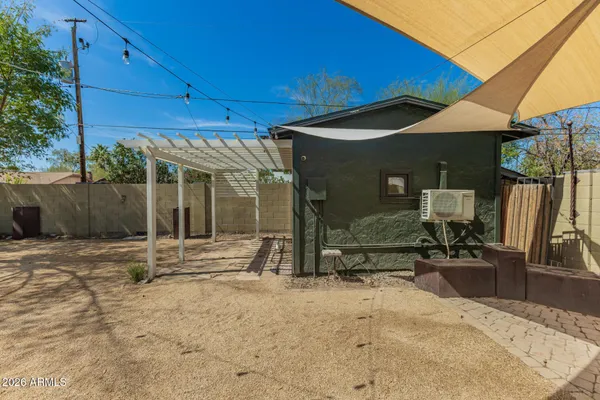 a backyard of a house with seating space