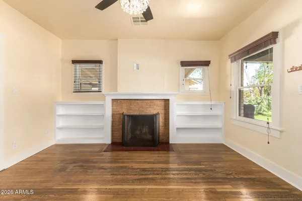 a view of a room that has a bed and a fireplace
