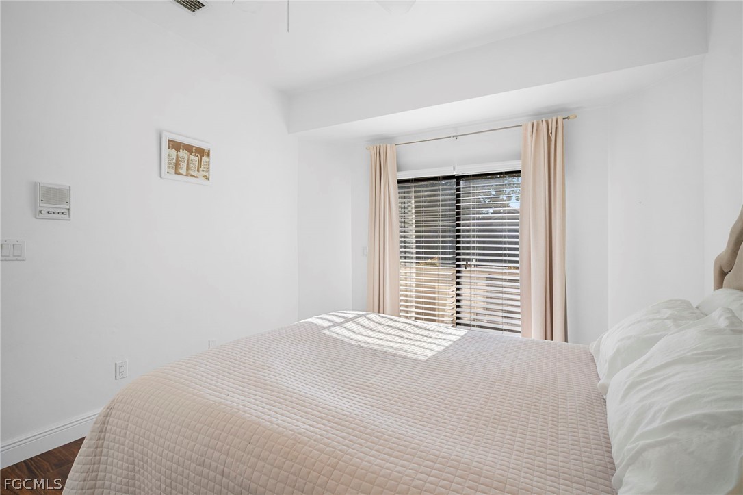 11772 Mahogany Run Fort Myers, FL 33913 - Photo 35 of 50 a bedroom with a bed and a window