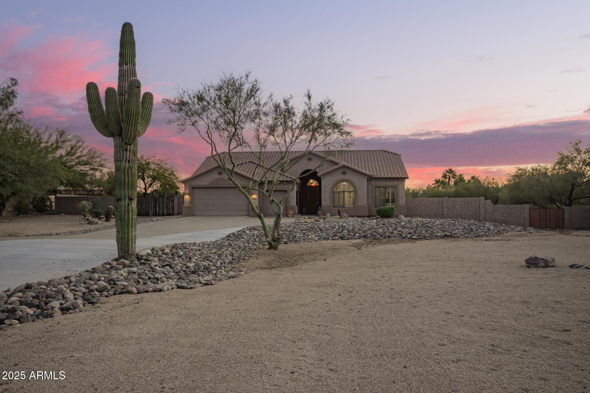 105 East Tanya Road Phoenix, AZ 85086 - Photo 13 of 63 a front view of a house with a yard and mountain view in back