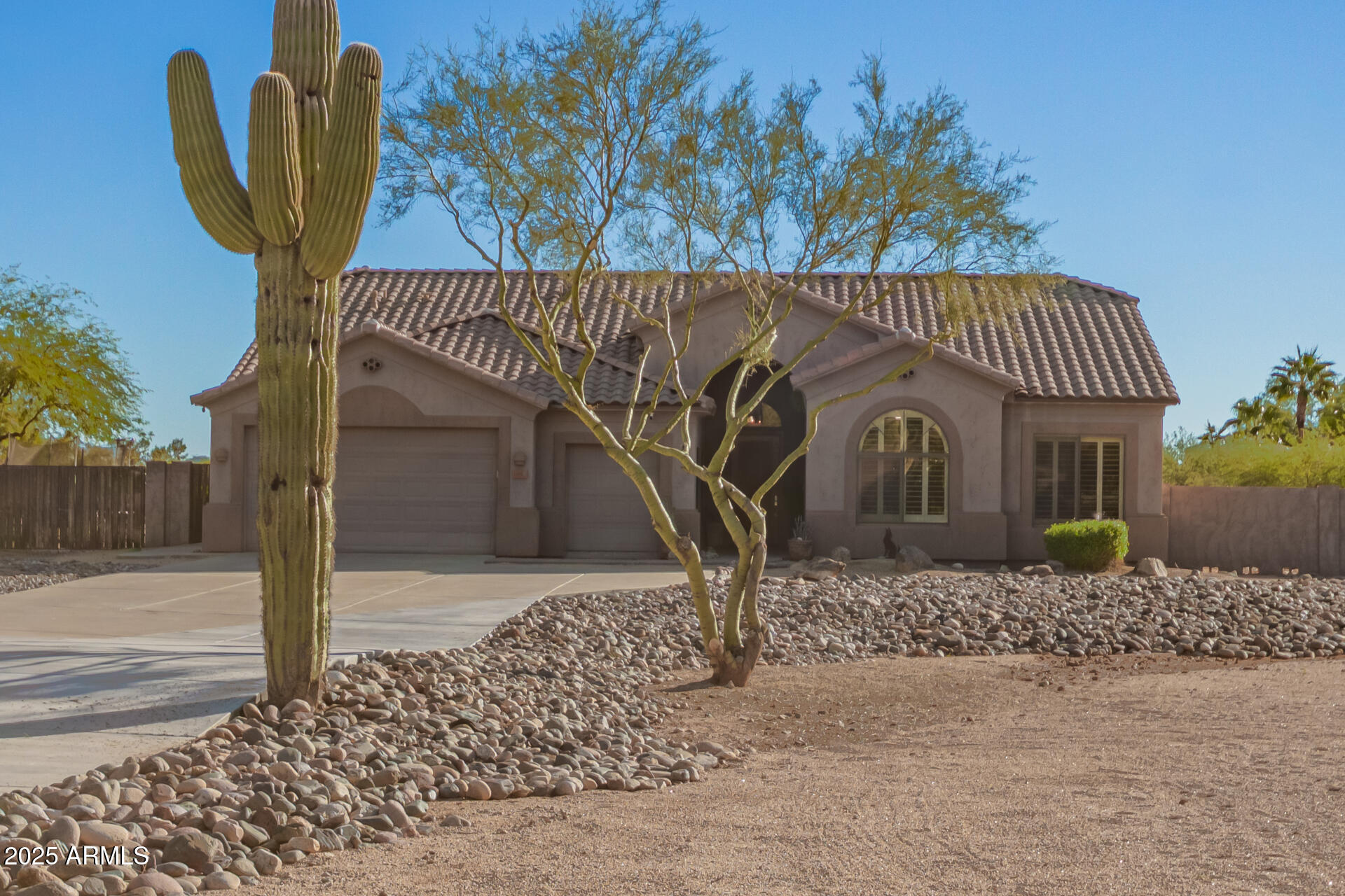 105 East Tanya Road Phoenix, AZ 85086 - Photo 16 of 63 a front view of a house with garden