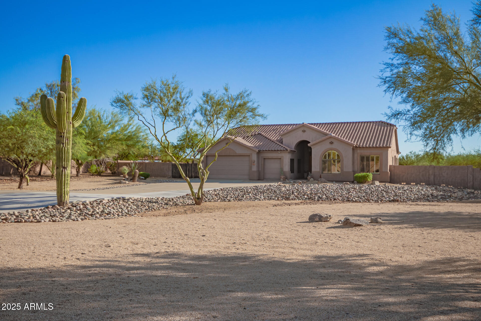 105 East Tanya Road Phoenix, AZ 85086 - Photo 17 of 63 a house with a tree in front of it
