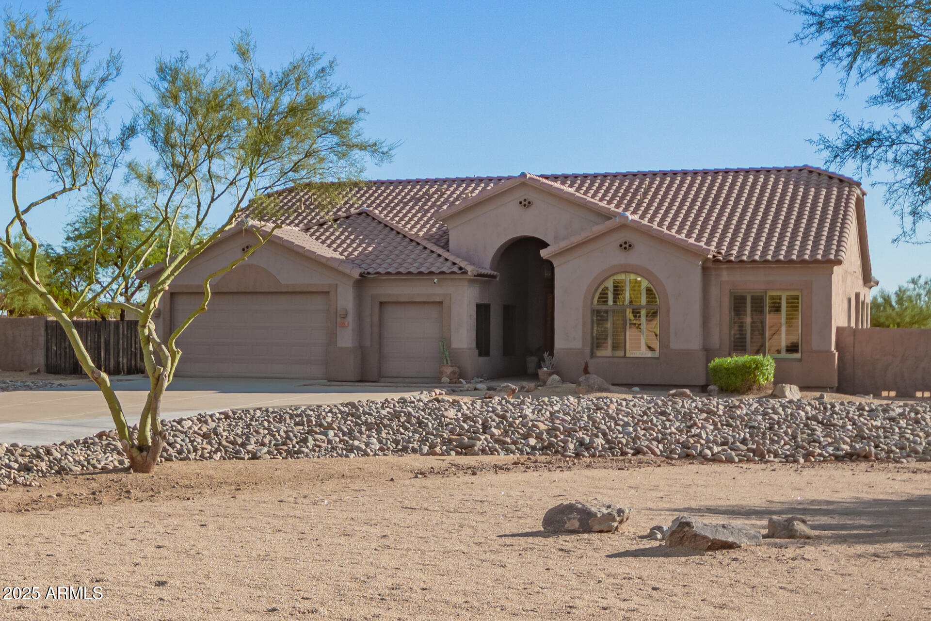105 East Tanya Road Phoenix, AZ 85086 - Photo 18 of 63 a front view of a house with garden