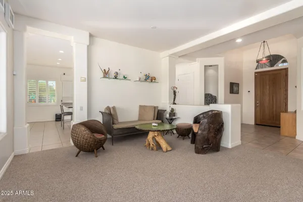 a view of a livingroom with furniture and a window