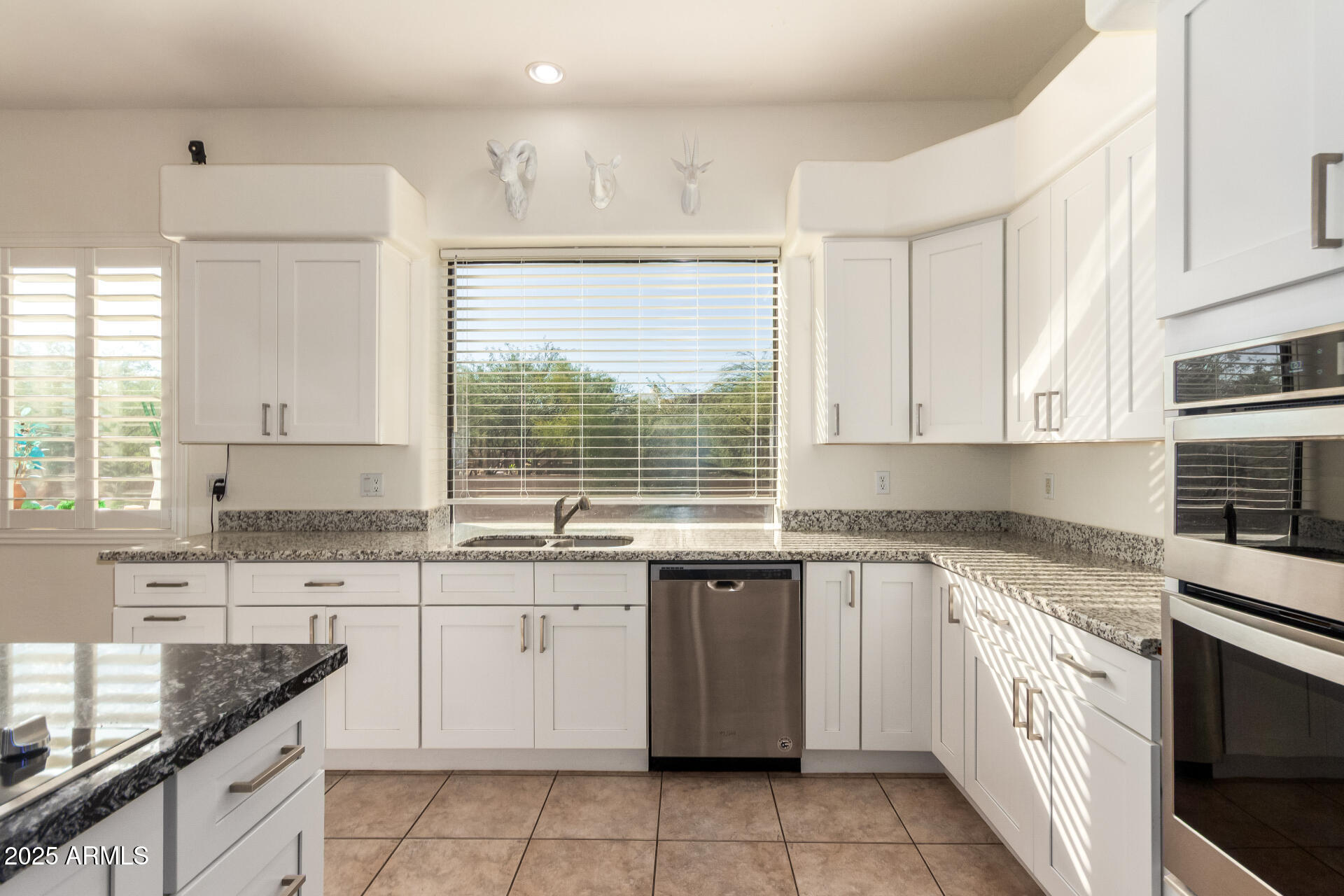 105 East Tanya Road Phoenix, AZ 85086 - Photo 29 of 63 a kitchen with a sink stove top oven and cabinets