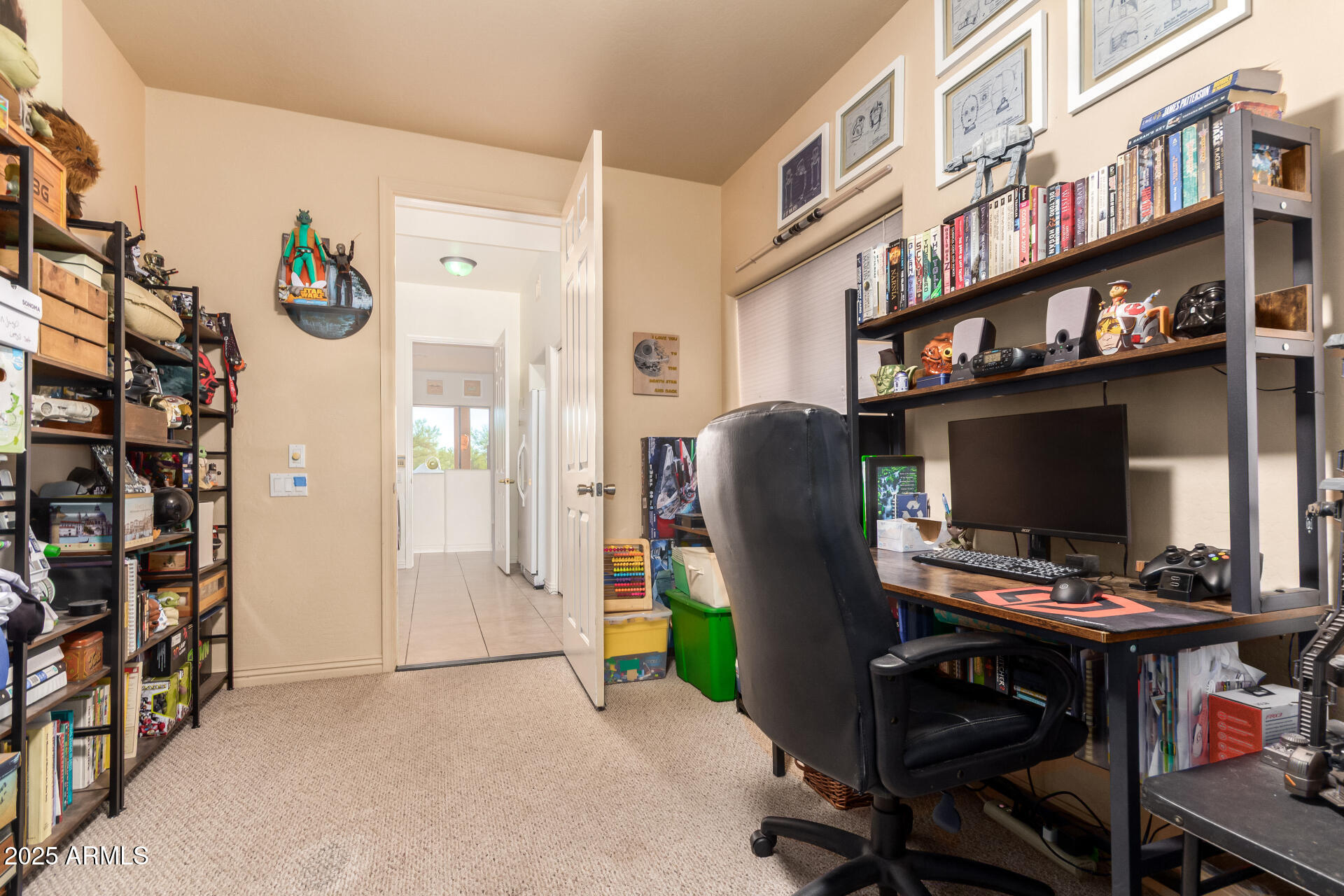 105 East Tanya Road Phoenix, AZ 85086 - Photo 44 of 63 a view of a workspace with furniture and a bookshelf
