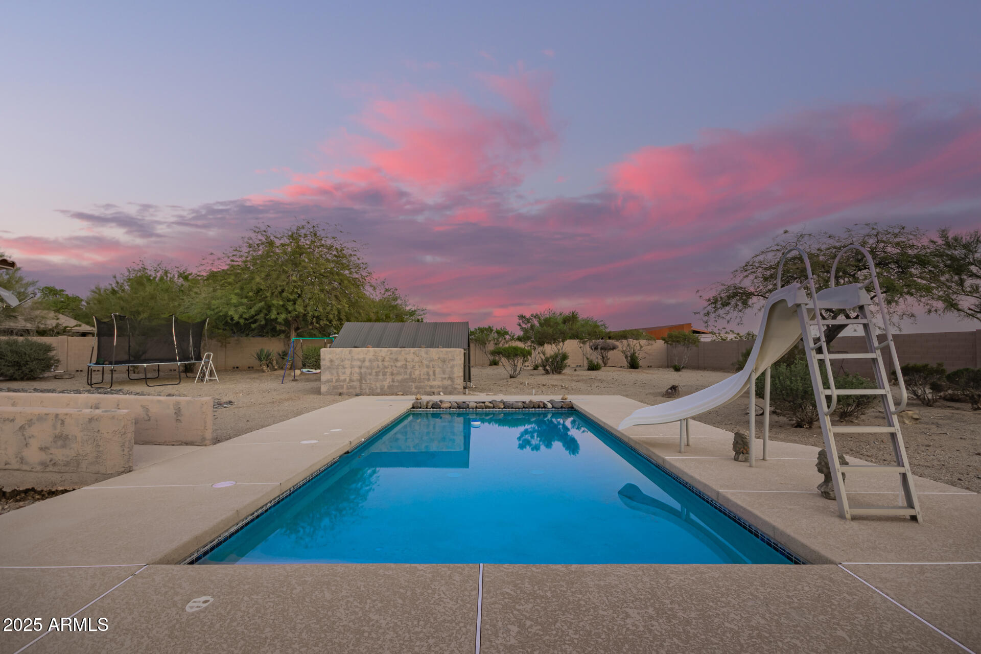 105 East Tanya Road Phoenix, AZ 85086 - Photo 47 of 63 a view of a swimming pool with a lounge chairs