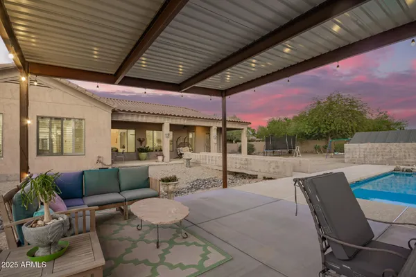 a kitchen with stainless steel appliances kitchen island granite countertop a refrigerator and cabinets