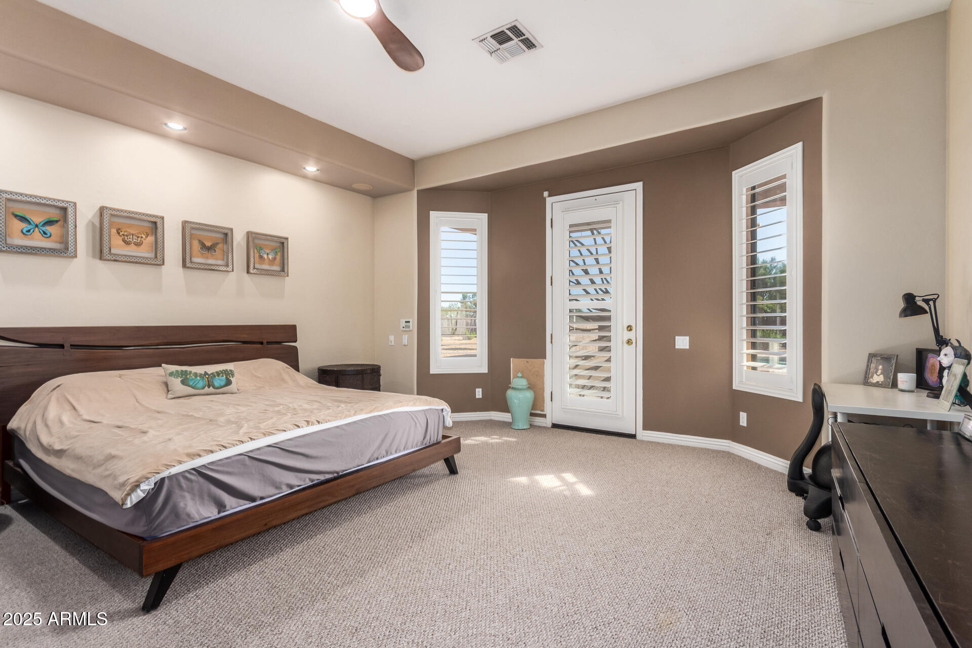 105 East Tanya Road Phoenix, AZ 85086 - Photo 7 of 63 a spacious bedroom with a bed and a window