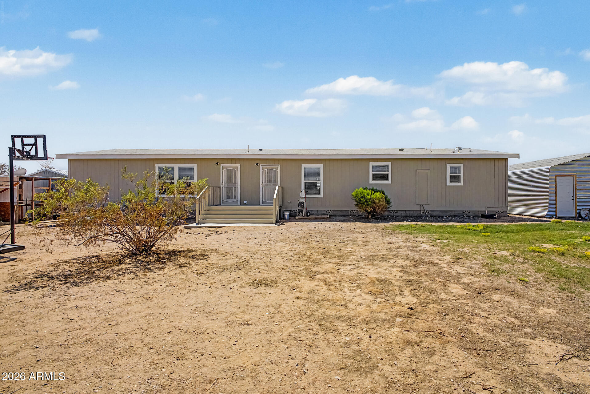 22417 West Dove Valley Road Wittmann, AZ 85361 - Photo 34 of 53 a view of a house with backyard
