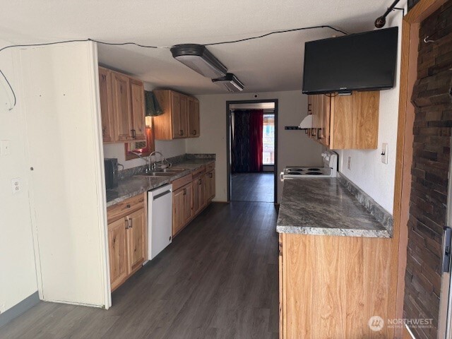1206 Sunset Street Southeast Ephrata, WA 98823 - Photo 10 of 11 a kitchen with stainless steel appliances granite countertop a sink and cabinets