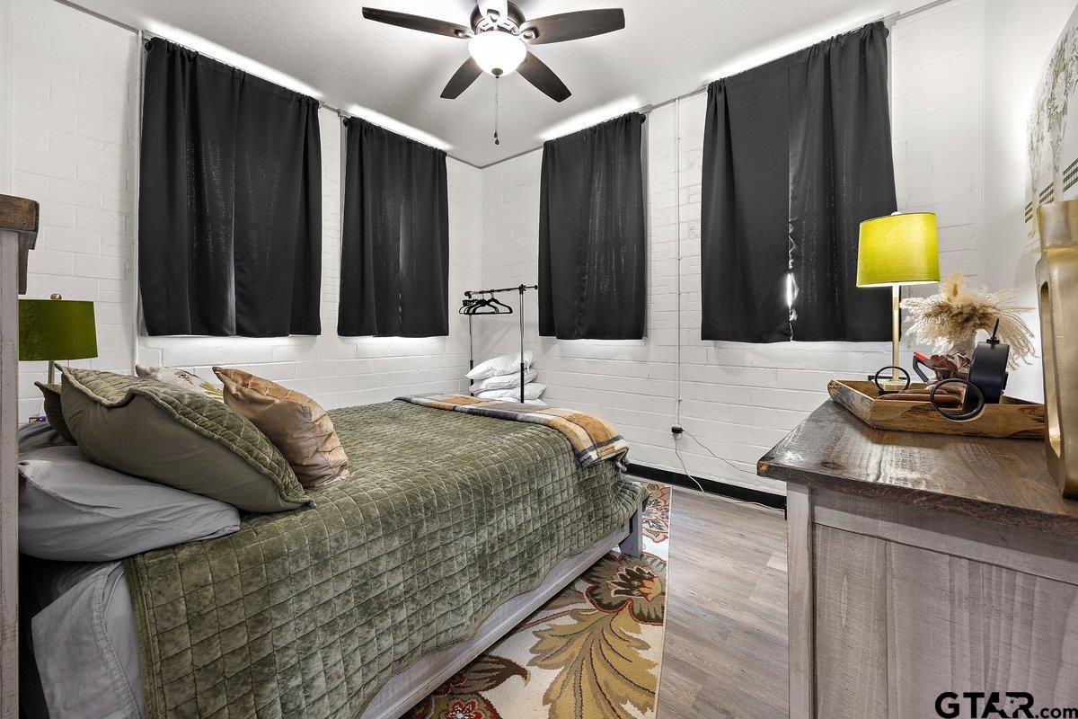 13089 US Highway 84 West Rusk, TX 75785 - Photo 22 of 43 a bedroom with a bed lamps and table