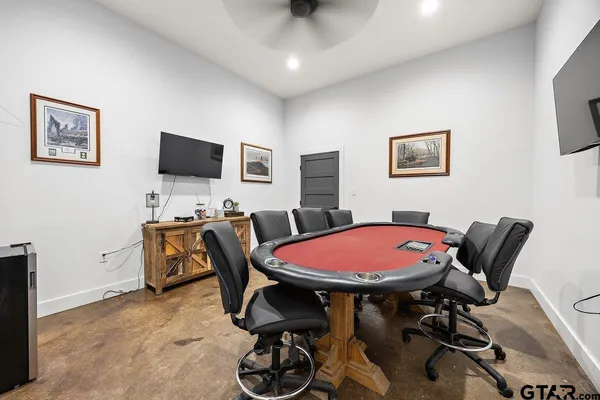 a view of a livingroom with workspace and a window