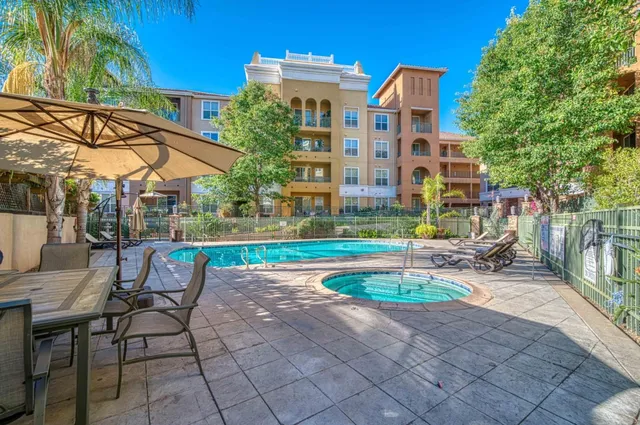a view of a chairs and table in the patio