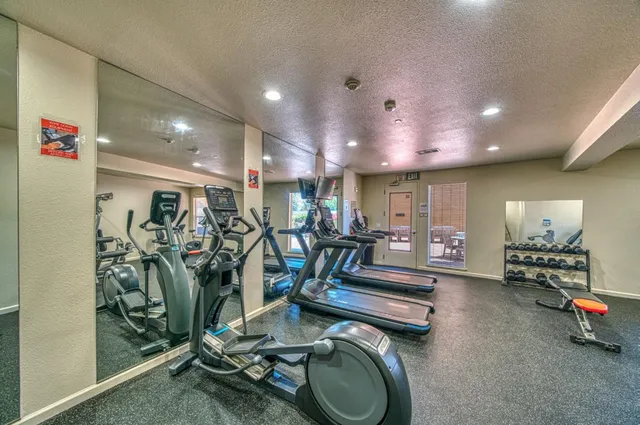 a view of a garage with cars