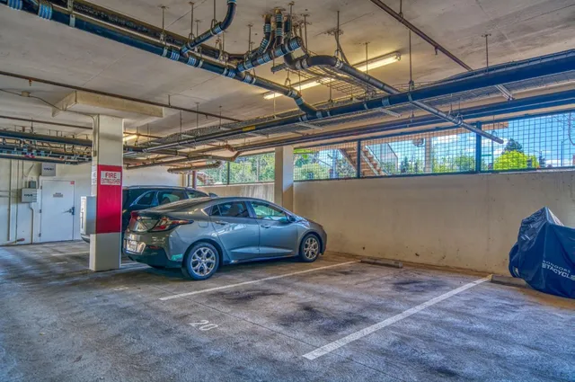 a view of a pathway with a wrought fence