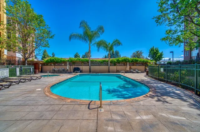 a view of a swimming pool with a patio