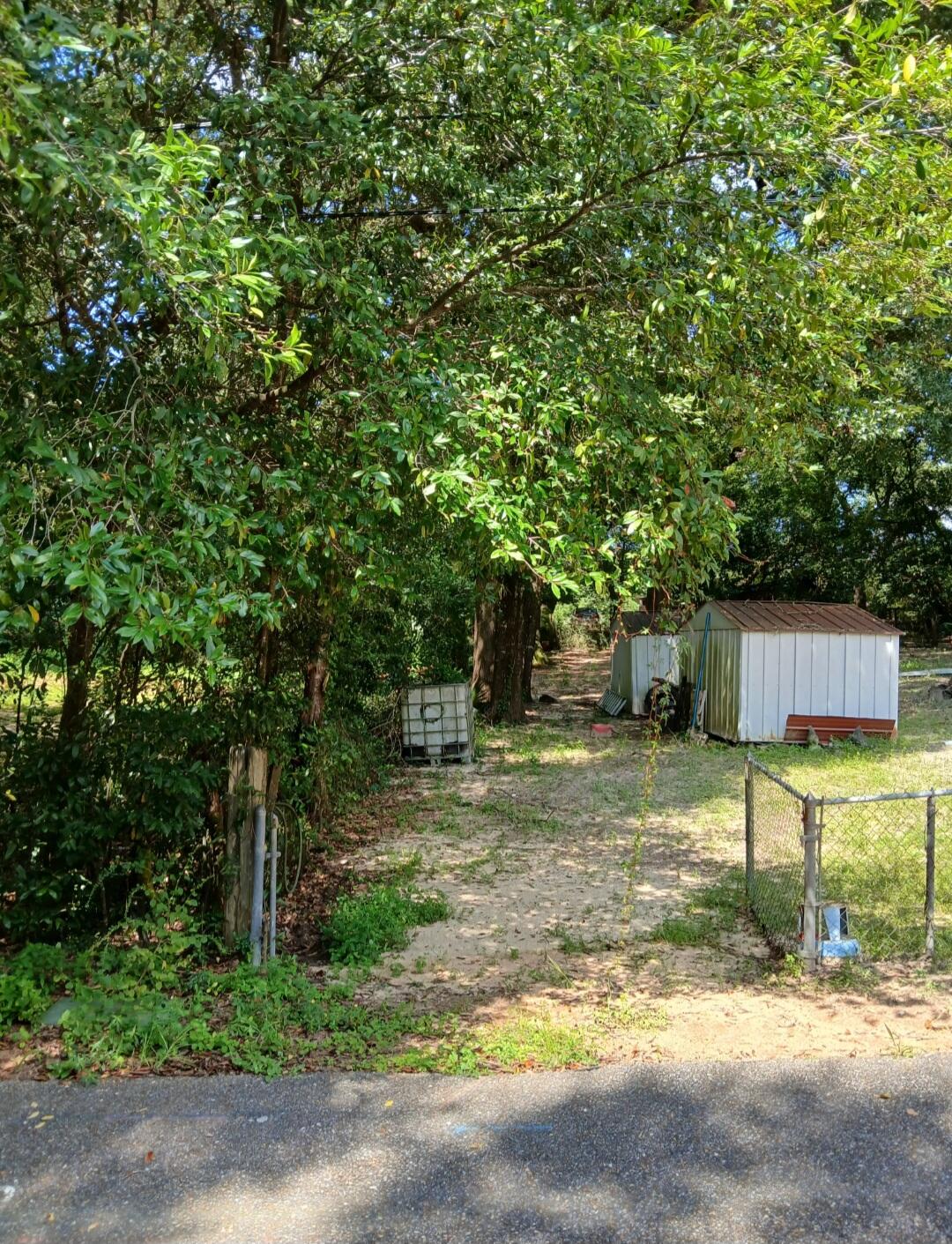 0 Benjamin Street Crestview, FL 32536 - Photo 3 of 7 a view of a yard with plants and trees
