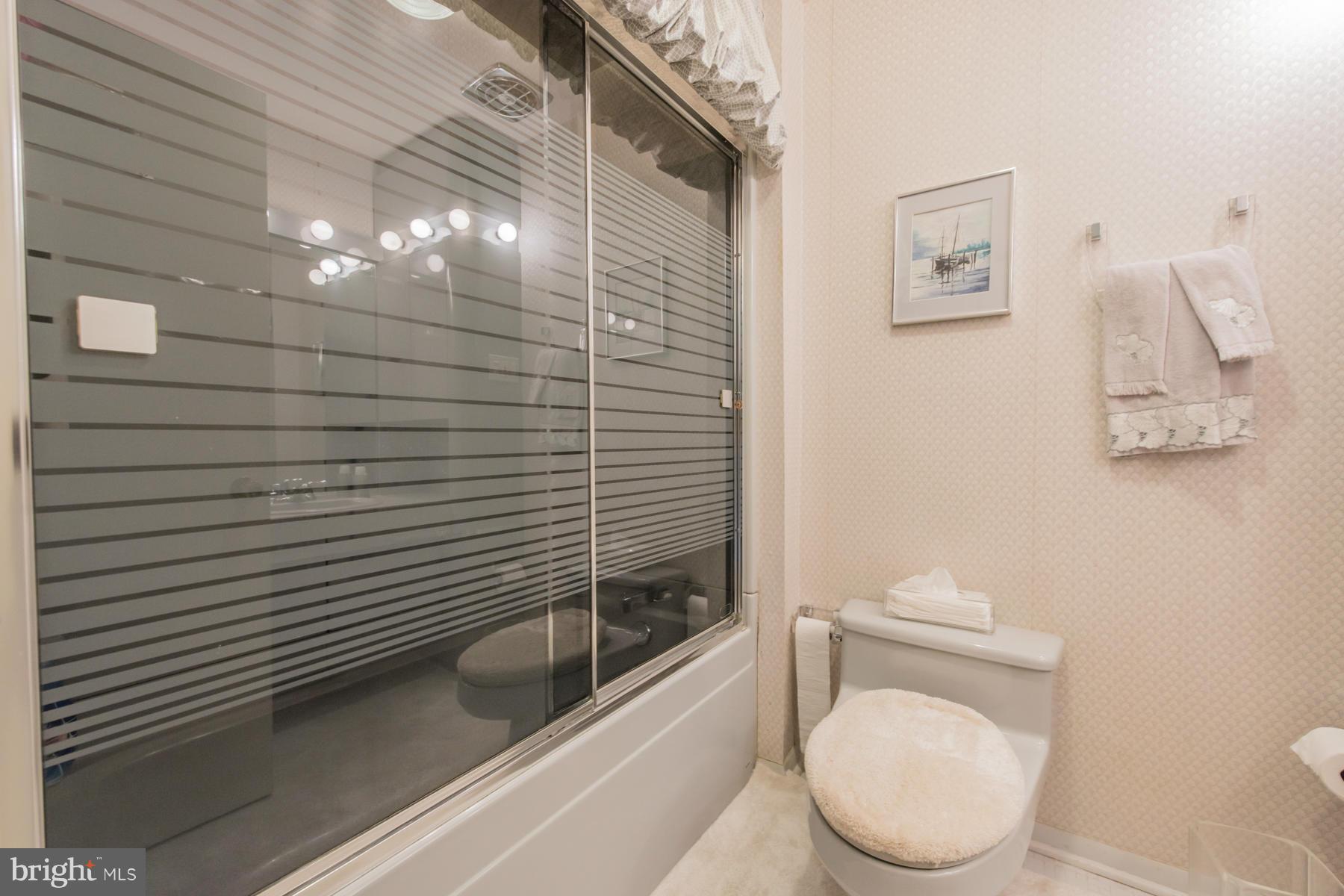 4703 Belle Forte Road Baltimore, MD 21208 - Photo 14 of 19 a bathroom with a toilet and a shower