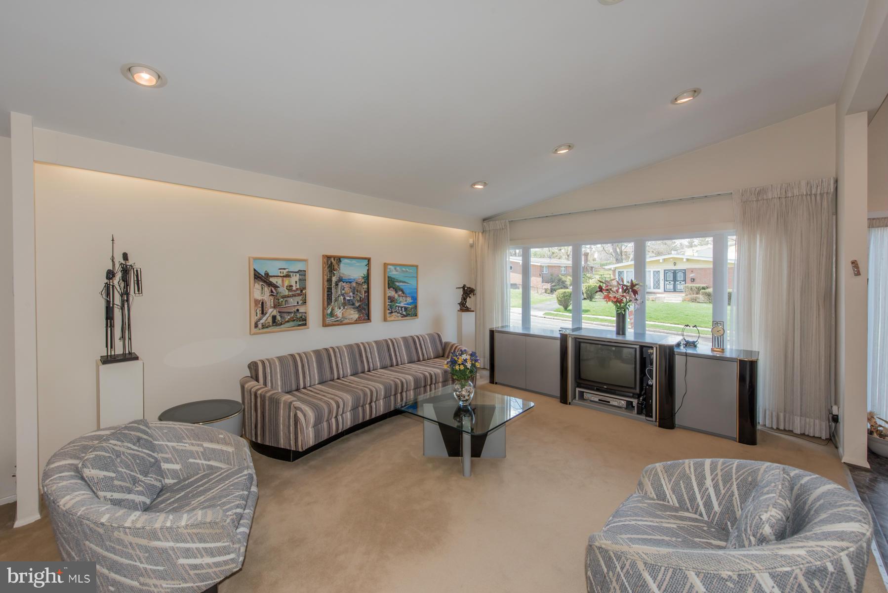 4703 Belle Forte Road Baltimore, MD 21208 - Photo 4 of 19 a living room with furniture and a large window