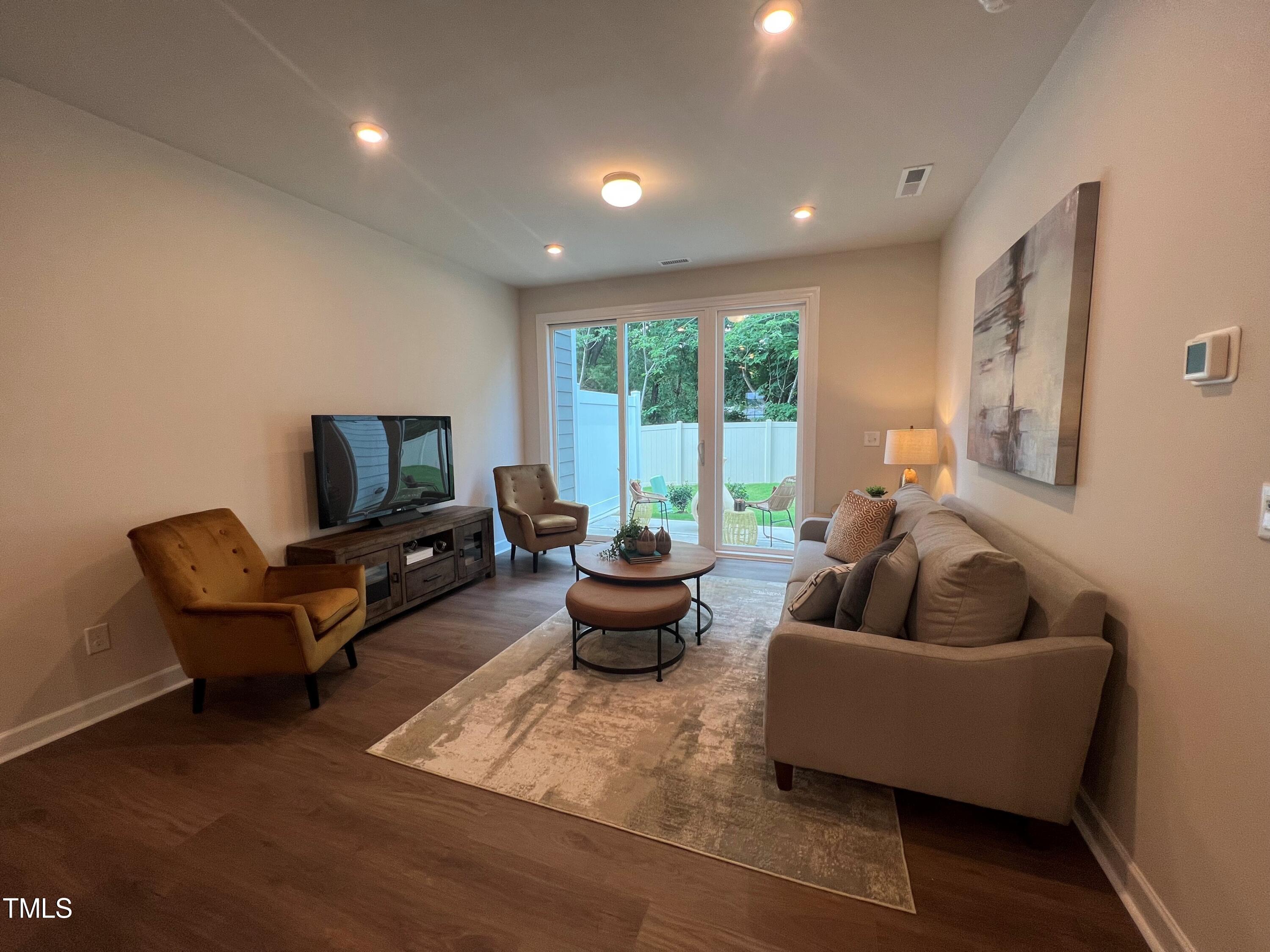 6102 Adecor Way Raleigh, NC 27617 - Photo 8 of 12 a living room with furniture and a potted plant