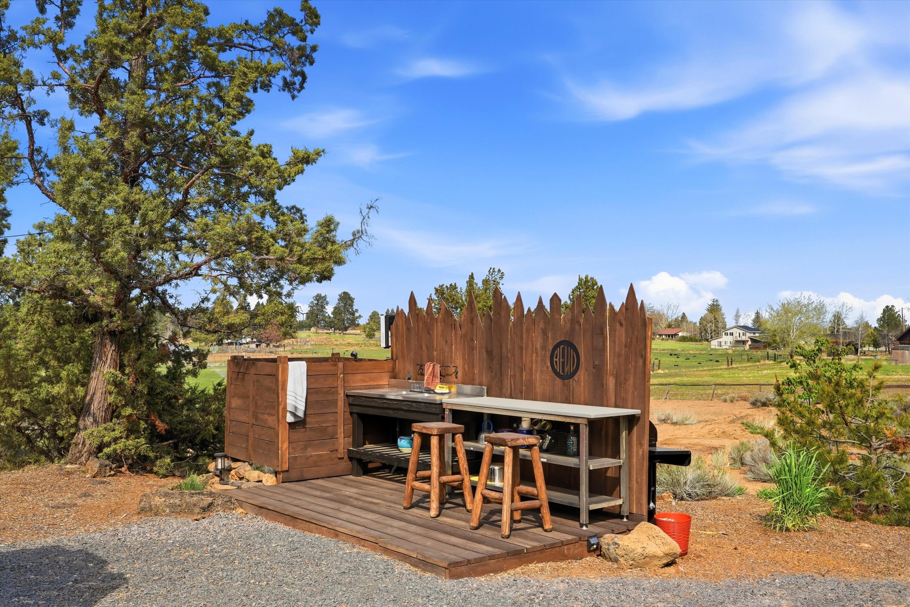 61280 Larsen Road Bend, OR 97702 - Photo 39 of 58 Outdoor kitchen and shower