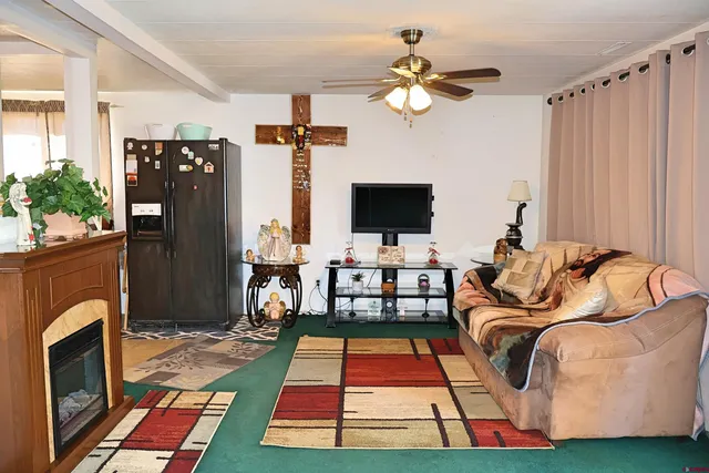 a bedroom with a bed and flat screen tv