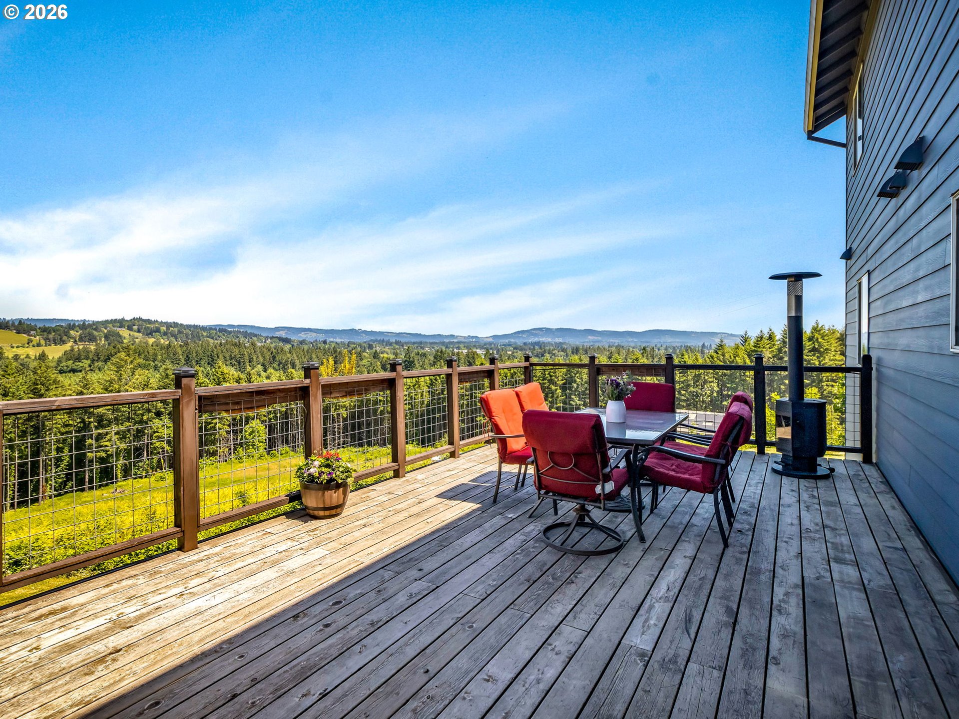 19775 Northeast Trunk Road Dundee, OR 97115 - Photo 15 of 48 a view of a balcony with wooden floor and outdoor seating