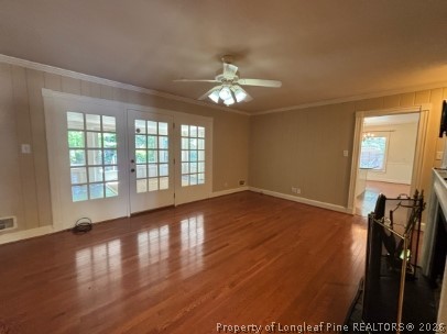 1513 Raeford Road Fayetteville, NC 28305 - Photo 11 of 25 a view of empty room with wooden floor and fan