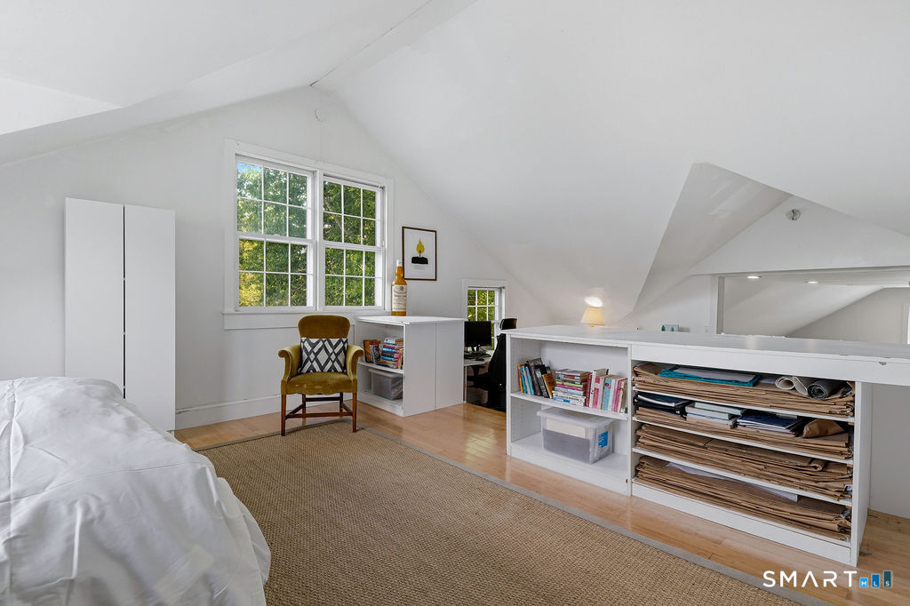 261-1 Grassy Hill Road Lyme, CT 06371 - Photo 29 of 40 Offering remarkable versatility, the expansive upper-level office provides ample space for working from home, creative endeavors, or additional living space.