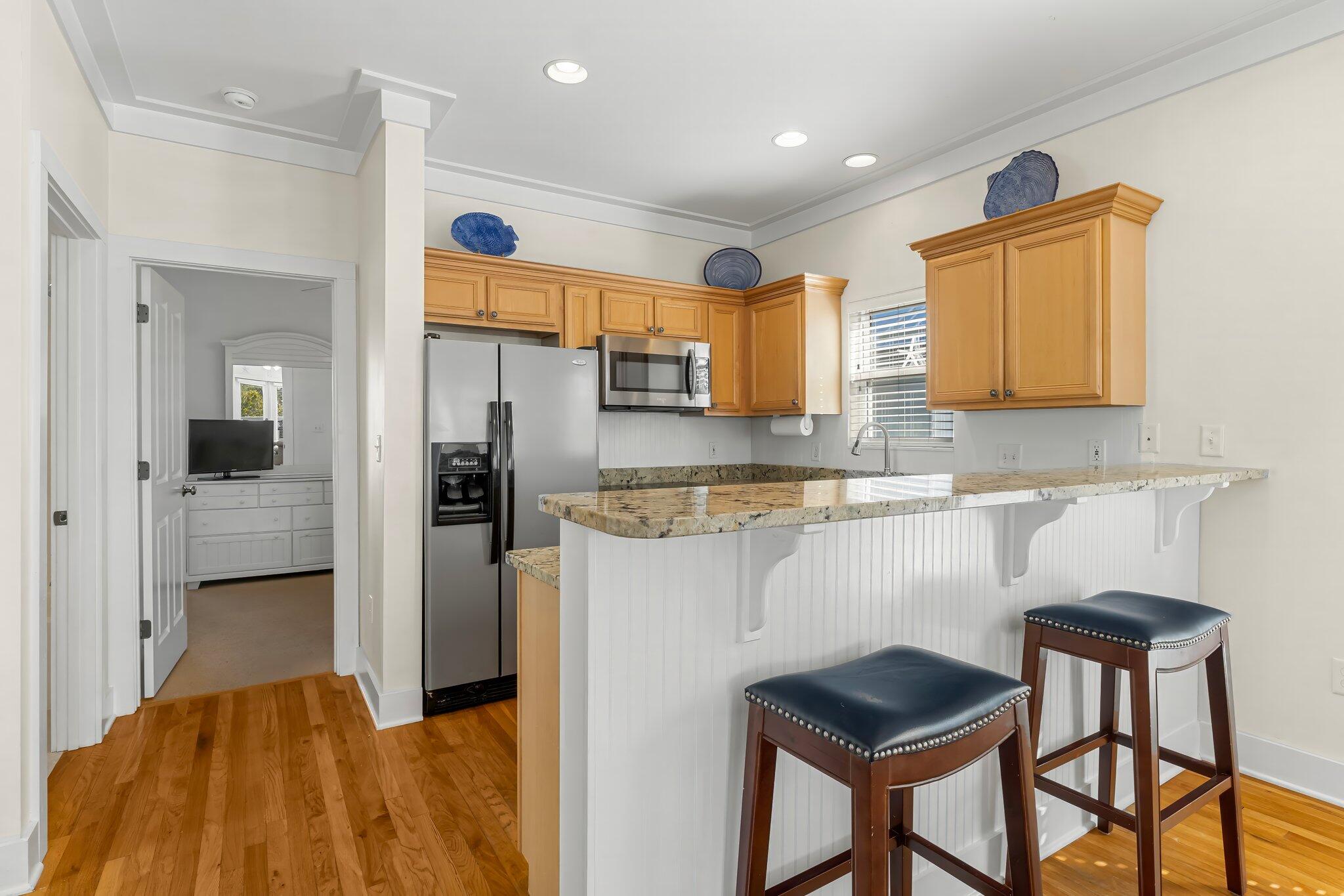 52 Cottage Way, Unit 5 Inlet Beach, FL 32461 - Photo 19 of 54 a kitchen with stainless steel appliances granite countertop a refrigerator and a sink