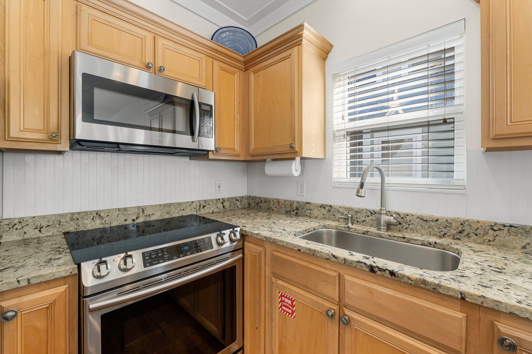 52 Cottage Way, Unit 5 Inlet Beach, FL 32461 - Photo 20 of 54 a kitchen with a stove microwave and sink
