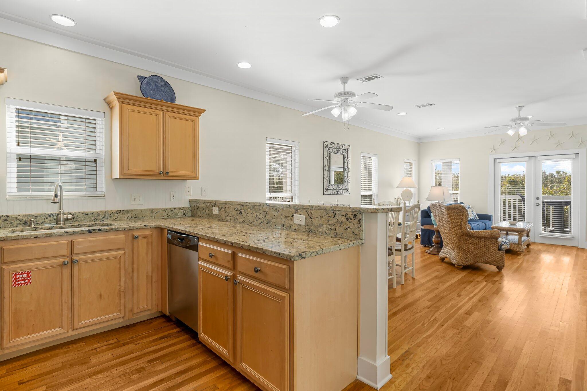 52 Cottage Way, Unit 5 Inlet Beach, FL 32461 - Photo 21 of 54 a open kitchen with granite countertop a stove and a sink