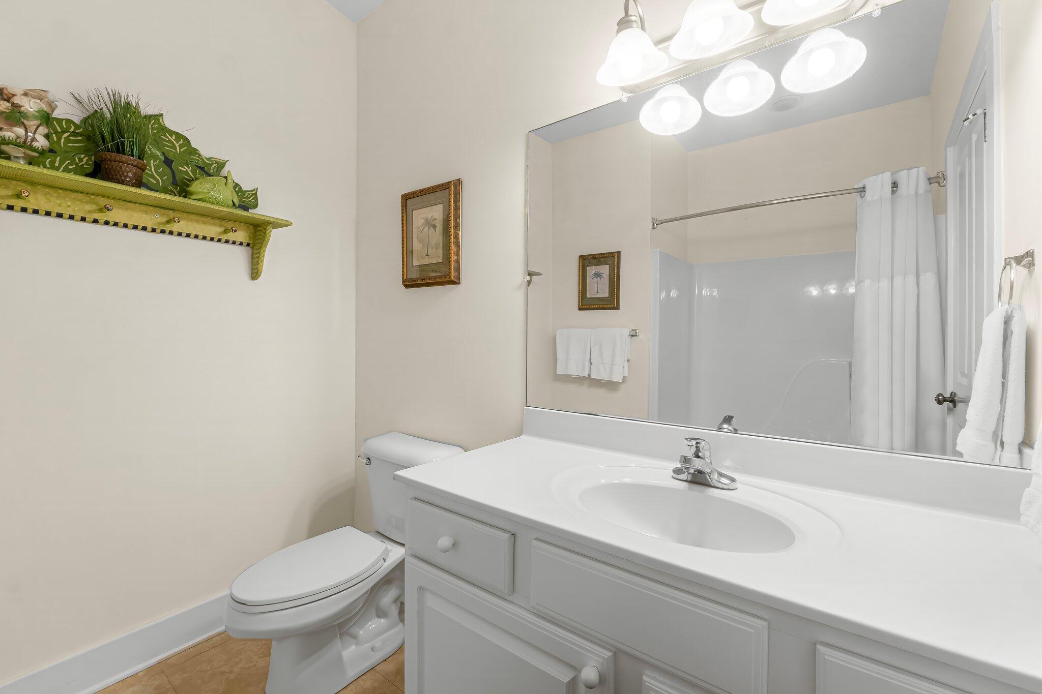 52 Cottage Way, Unit 5 Inlet Beach, FL 32461 - Photo 28 of 54 a bathroom with a toilet sink and mirror