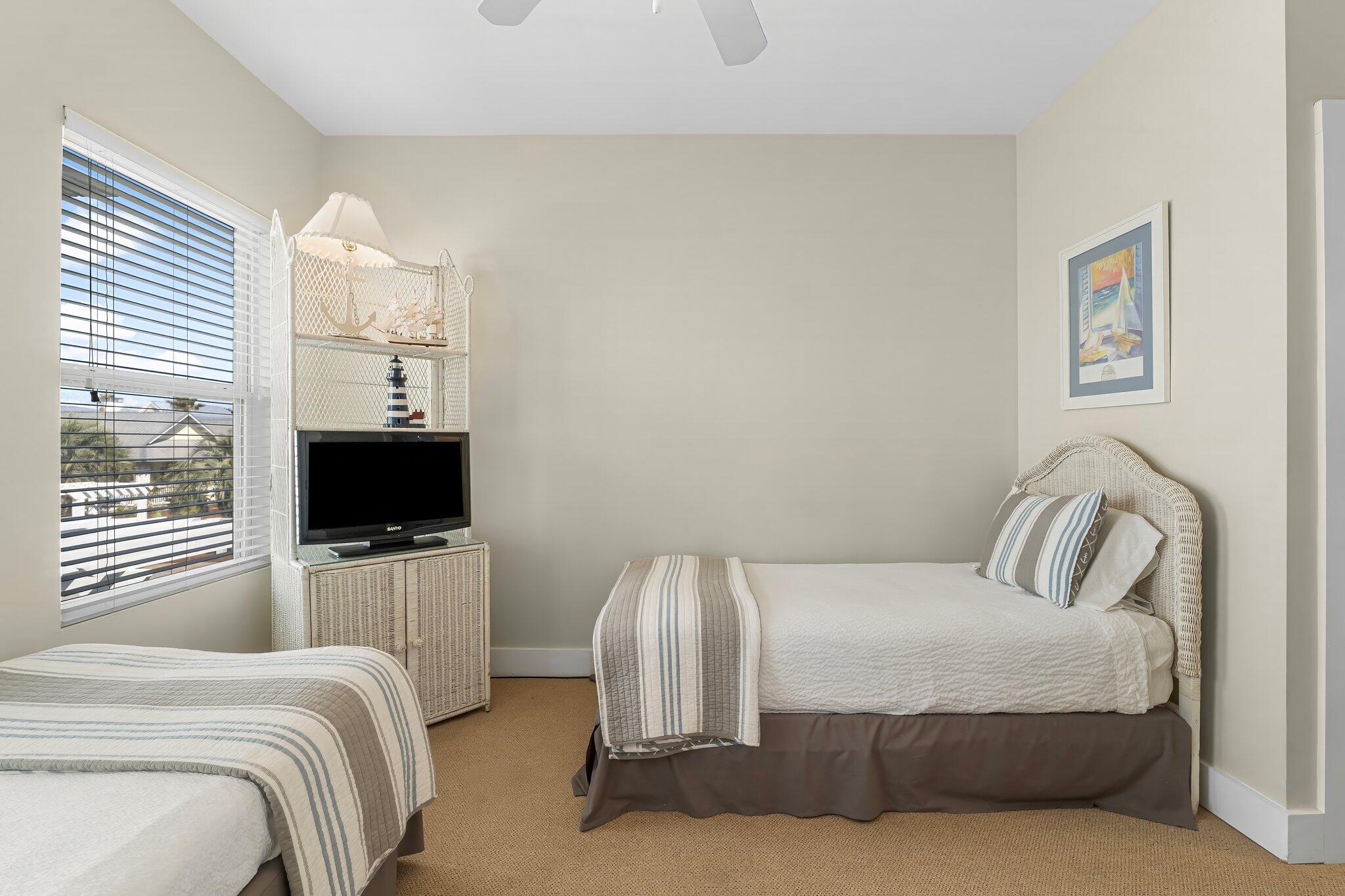 52 Cottage Way, Unit 5 Inlet Beach, FL 32461 - Photo 29 of 54 a bedroom with a bed and a flat screen tv