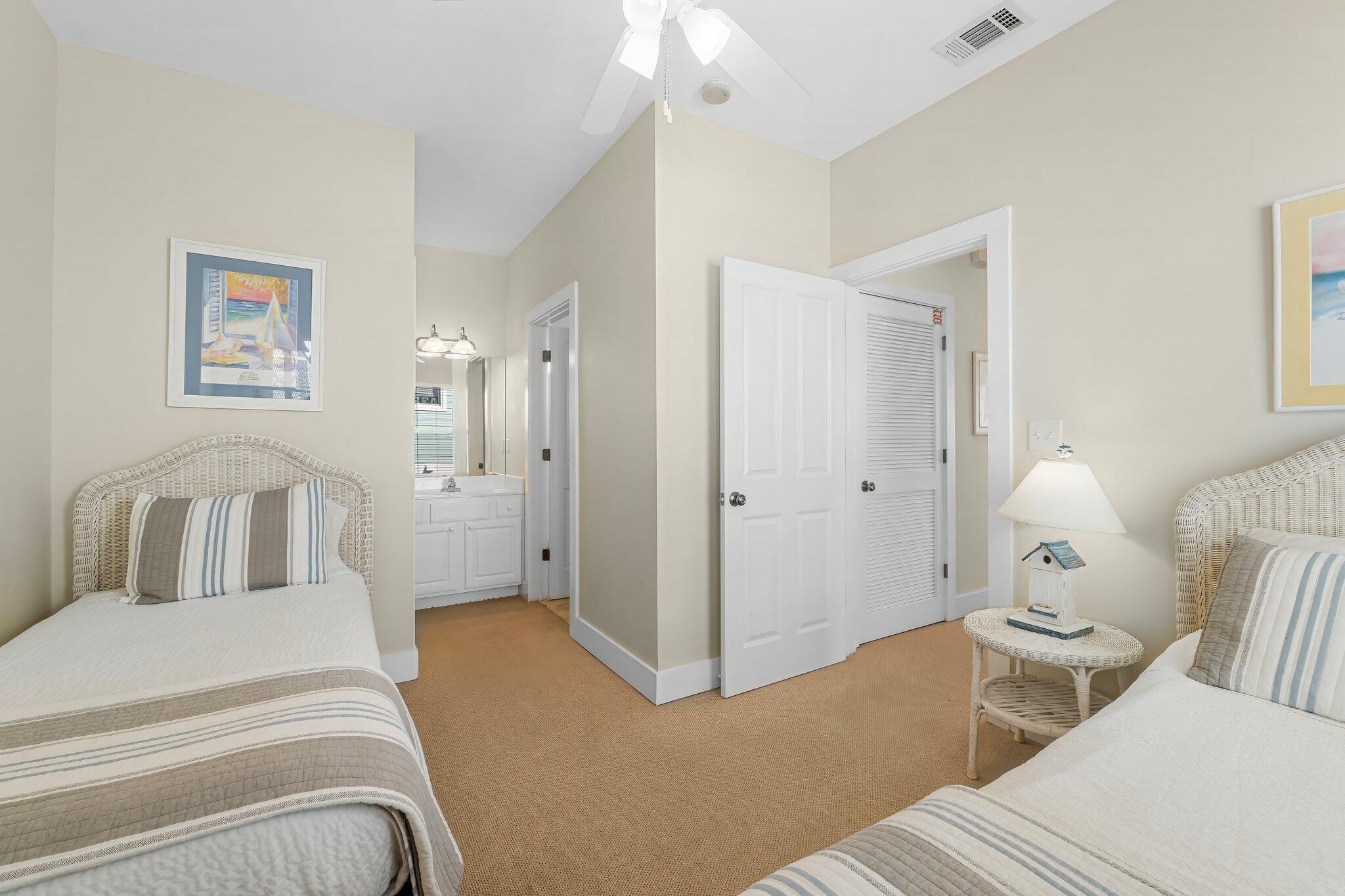 52 Cottage Way, Unit 5 Inlet Beach, FL 32461 - Photo 30 of 54 a bedroom with a bed and a chandelier