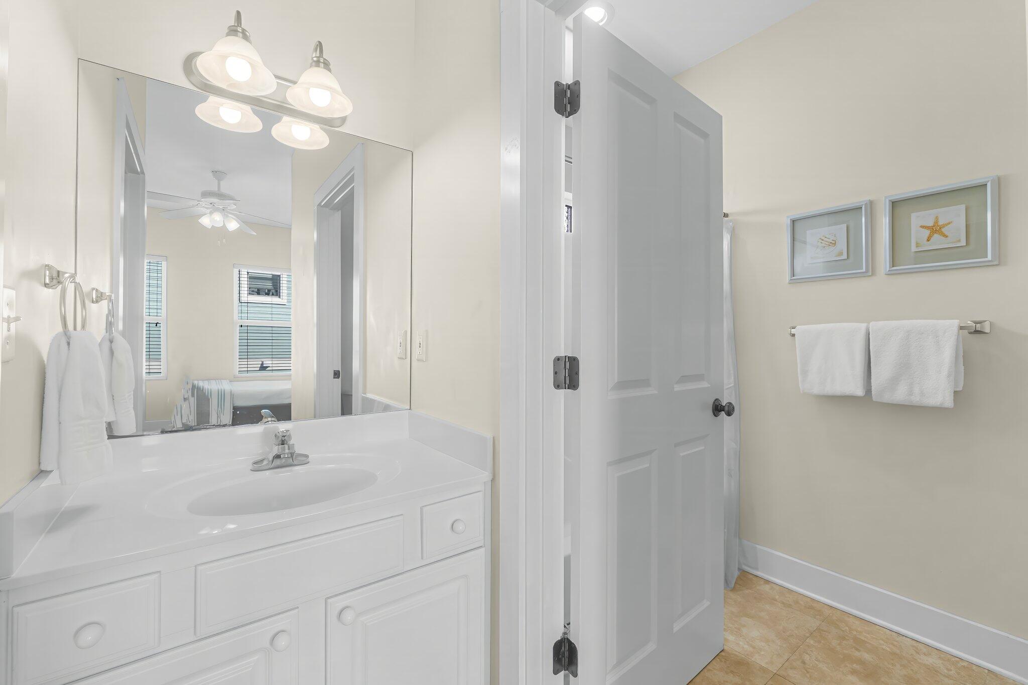 52 Cottage Way, Unit 5 Inlet Beach, FL 32461 - Photo 31 of 54 a bathroom with a sink vanity and a mirror