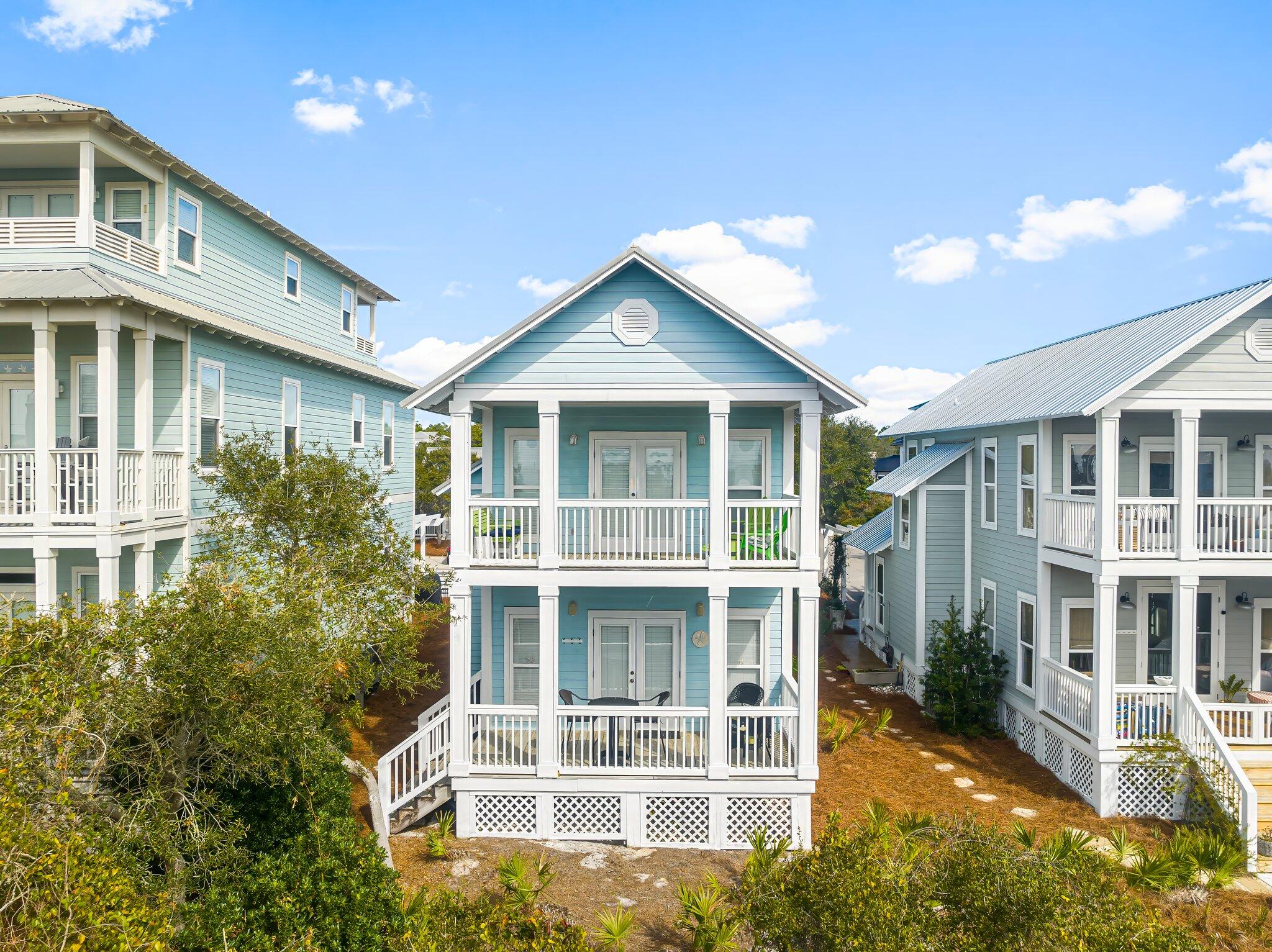 52 Cottage Way, Unit 5 Inlet Beach, FL 32461 - Photo 39 of 54 a front view of a building with a garden