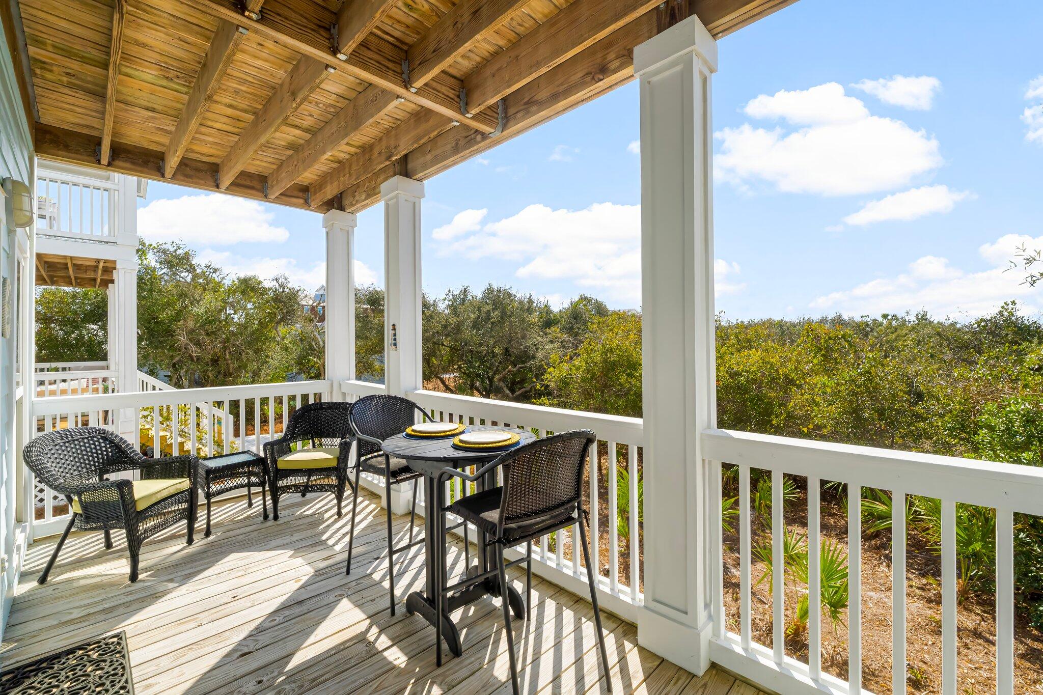 52 Cottage Way, Unit 5 Inlet Beach, FL 32461 - Photo 10 of 54 a view of a balcony with chairs and wooden floor