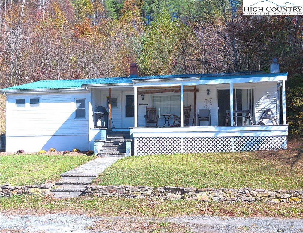 9752 Old Highway 16 Crumpler, NC 28617 - Photo 1 of 26 front view of a house with a yard