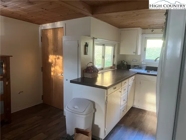 a kitchen with sink and cabinets