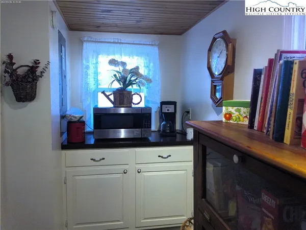 a kitchen with stainless steel appliances a stove and a wooden floors
