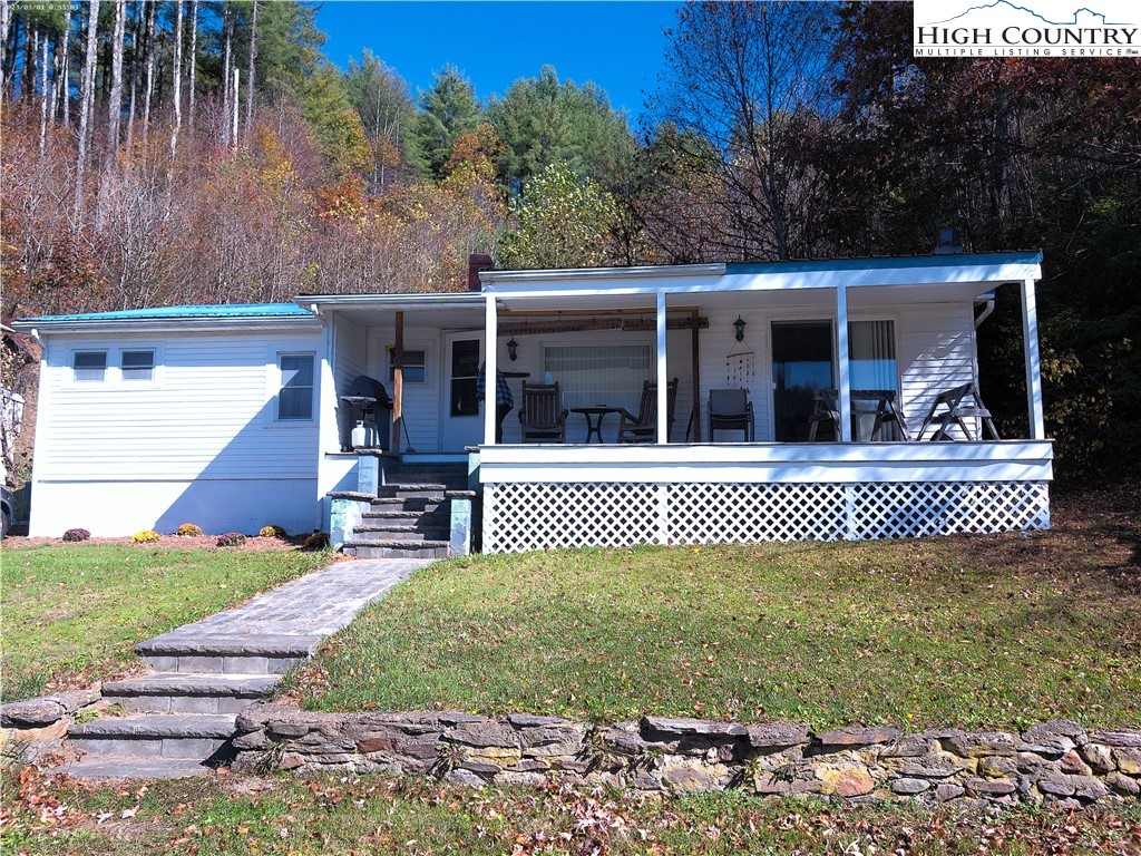 9752 Old Highway 16 Crumpler, NC 28617 - Photo 2 of 26 a front view of a house with a yard