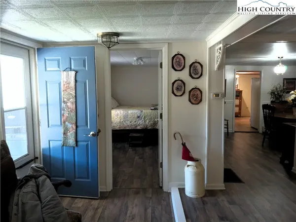 a view of an entryway door with wooden floor